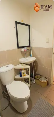 a bathroom with a toilet and a sink at JFam Suites, C3-9D Studio, Up To 4 Pax in Biñan