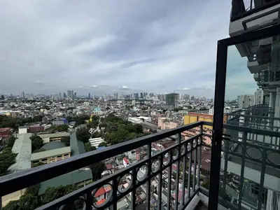 a view of a city from a balcony at Modern 1 bedroom w Pool and City Views in Manila
