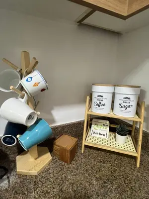 a room with a table with a robot and two buckets at Mysuites2go 517 Lenden in Manila