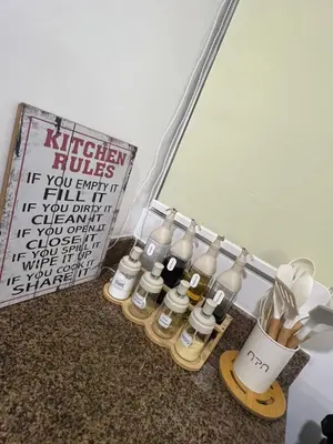 a group of bottles of essential oils next to a mirror at Mysuites2go 517 Lenden in Manila