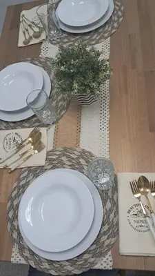 a table set with white plates and a plant on it at Mysuites2go 517 Lenden in Manila