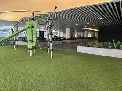 a playground in a building with a slide at Makati City Ph SnowWhite Staycation in Manila