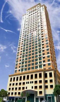 a large tall building with a sky in the background at The orienthal place, Makati a1 in Manila