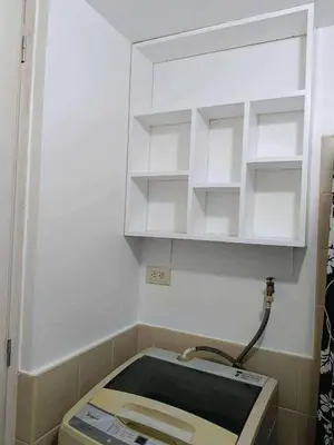a kitchen with a sink and a box in a room at The orienthal place, Makati a1 in Manila