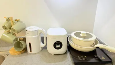 a group of appliances sitting on a counter in a kitchen at Harbour Park Residences Cozy 1BR Suite in Manila