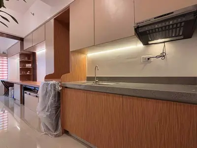 a kitchen with a sink and a counter top at 1-BR condo unit near Rockwell, Poblacion in Manila