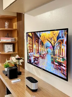 a flat screen tv hanging on a wall at 1-BR condo unit near Rockwell, Poblacion in Manila