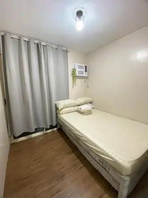 a small room with a bed and a window at Your Comfort Zone Staycation3 in Manila