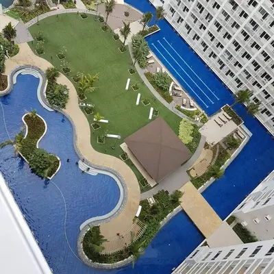 a model of a large building next to the water at Shore 1 Residences - ÜniQa Suite - MOA Area in Manila