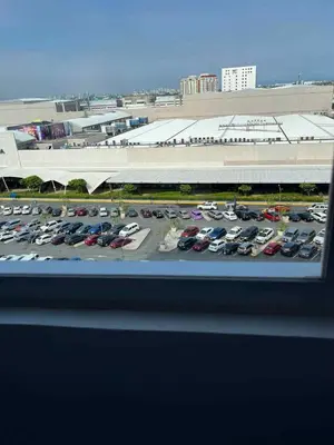 a view of a parking lot with cars parked at South Residences Tower 4, Las Pinas in Manila