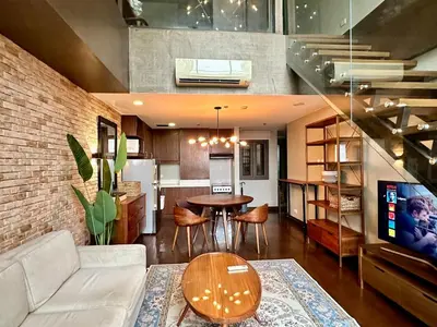 a living room with a couch and a table at 100 SQM 3BR in Central Makati Greenbelt Area in Manila