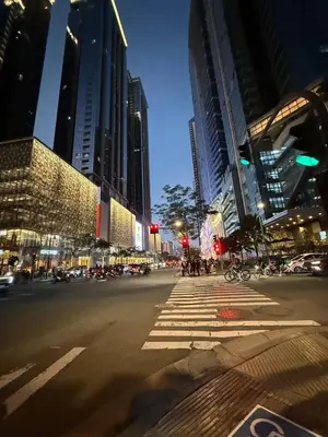 a city street at night with traffic lights and buildings at Executive Suites 4 Bedroom Condo Uptown Parksuites Bgc in Manila