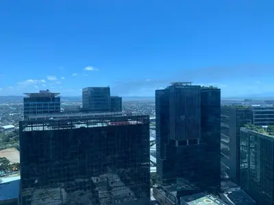 a group of tall buildings in a city at Executive Suites 4 Bedroom Condo Uptown Parksuites Bgc in Manila