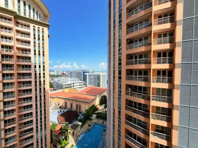 an aerial view of two tall buildings at PREMIUM 1BR Venice Canal Mall, Pool, Gym, Sauna & 5G Wi-Fi, Ste 16 in Manila