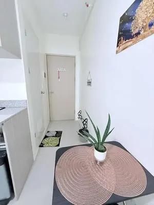 a room with a table with a potted plant on it at Cozy Place to Stay in Manila