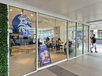 a store front with a sign in the window at Family Suite with Big Balcony and Pool View in Manila