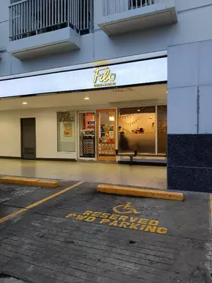 an empty parking lot in front of a store at SEA RESIDENCES Golden in Manila