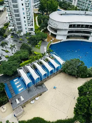 an overhead view of a building with a swimming pool at Affordable Boracay-like Staycation in Azure South in Manila