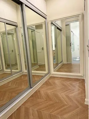 a room with four windows and a wooden floor at Elegant 4BR penthouse in BGC in Manila