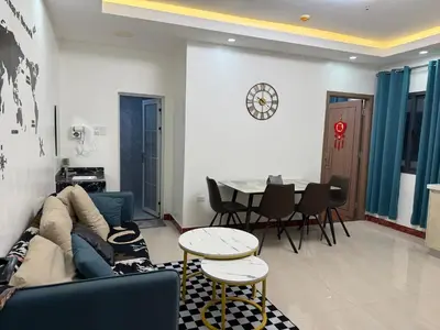 a living room with a couch and a table at 2 AC in 1 Room JCAL Building Near Manila Airports MOA OKADA in Manila