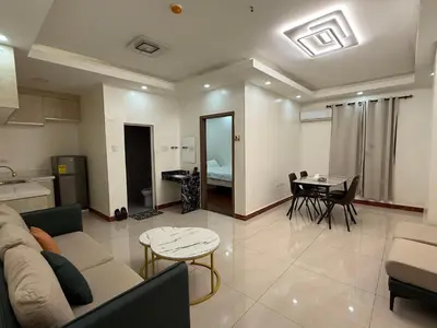 a living room with a couch and a table at 2 AC in 1 Room JCAL Building Near Manila Airports MOA OKADA in Manila
