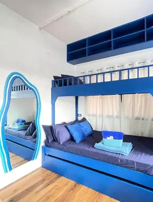 a bunk bed with blue bunk beds in a room at Studio Type for Rent along Ortigas Ave Ext in Cainta