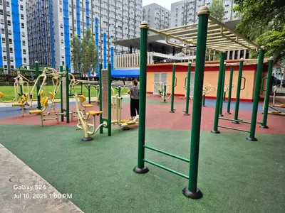 a playground in a city with a play area at Cozy 3-Bedroom Family Condo in Manila