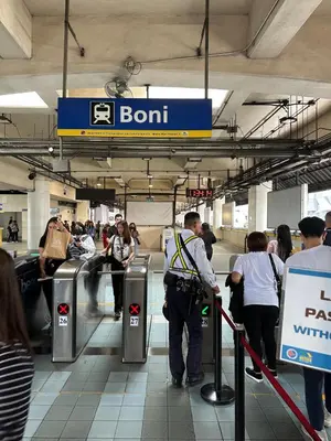 a crowd of people in a subway station at Amazing Sunrise View 2 Bed Room, QLED 65-Inch Samsung TV, Disney & Max, Max 5 Adult and 2 kids in Manila