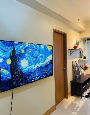 a painting of the starry night on a wall at CabinandCo in Manila