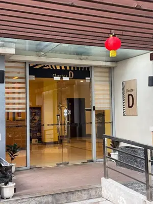 a front door of a building with a red light at Newport Stay Walk to NAIA T3 in Manila