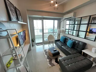 an overhead view of a living room with a couch at Amorsolo Tower Makati in Manila