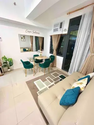 a living room with a couch and a table at FREE Parking City lights AlexaVoice Control Unit in Manila
