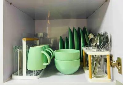 a bunch of green cups and utensils on a shelf at FREE Parking City lights AlexaVoice Control Unit in Manila