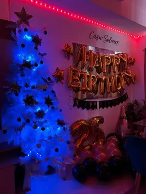 a christmas tree with blue lights and a happy birthday sign at FREE Parking City lights AlexaVoice Control Unit in Manila