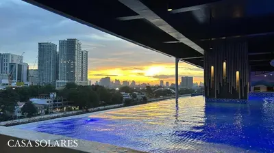 a swimming pool on top of a building with a city skyline at FREE Parking City lights AlexaVoice Control Unit in Manila