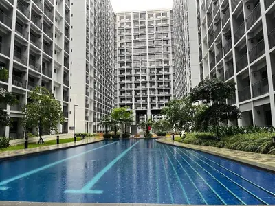 a swimming pool in a city with tall buildings at Metro Prime Staycations at Shore 2 Residences T1 in Manila