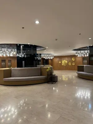 a lobby with couches and chairs in a building at Metro Prime Staycations at Shore 2 Residences T1 in Manila