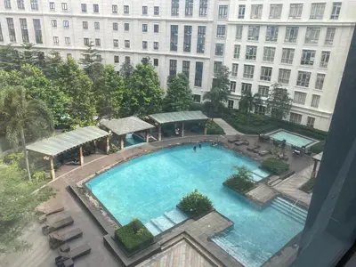 an overhead view of a large swimming pool in front of a building at 3ms and jacob havens in Manila