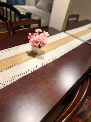 a vase of pink flowers sitting on a table at 3ms and jacob havens in Manila