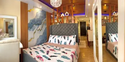 a bedroom with a bed in a room at J&J Havenstay Ananda Square in Manila
