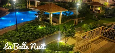an overhead view of a swimming pool at night at Prisma La Belle Nuit in Manila