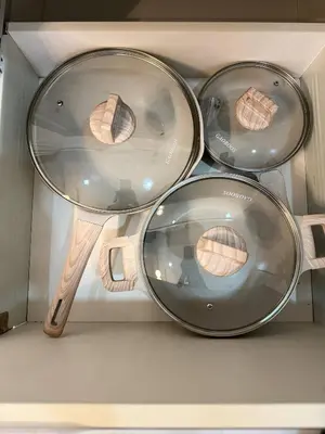 three pans in a microwave with some food inside at Stunning 42nd Floor Apt with Netflix in Manila
