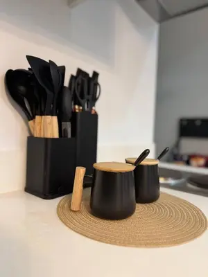 a kitchen counter with two pots and utensils at Stunning 42nd Floor Apt with Netflix in Manila