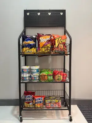 a shelf with chips and other snacks on it at Stunning 42nd Floor Apt with Netflix in Manila