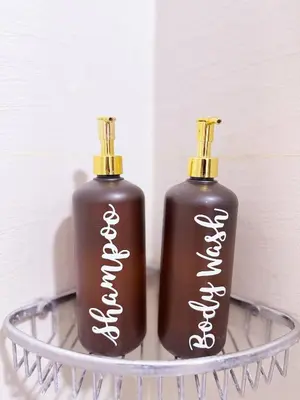 two bottles of soap sitting on a metal tray at Stunning 42nd Floor Apt with Netflix in Manila