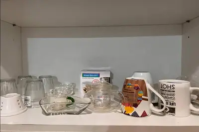 a shelf with a bunch of kitchen items on it at 81 Newport Boulevard across NAIA T3 Airport in Manila