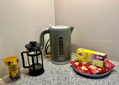 a kitchen counter with a coffee maker and a blender at Bayshore 2 ManilaBay Seaview 3 in Manila