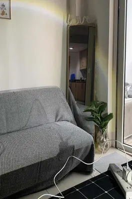 a bedroom with a bed and a mirror at HJ Haven in Manila