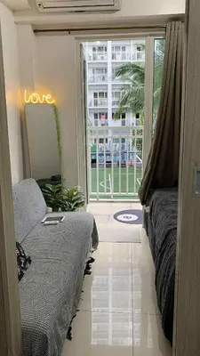 a room with a bed and a window with a view at HJ Haven in Manila