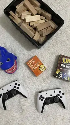a table with two video game controllers and a box at HJ Haven in Manila